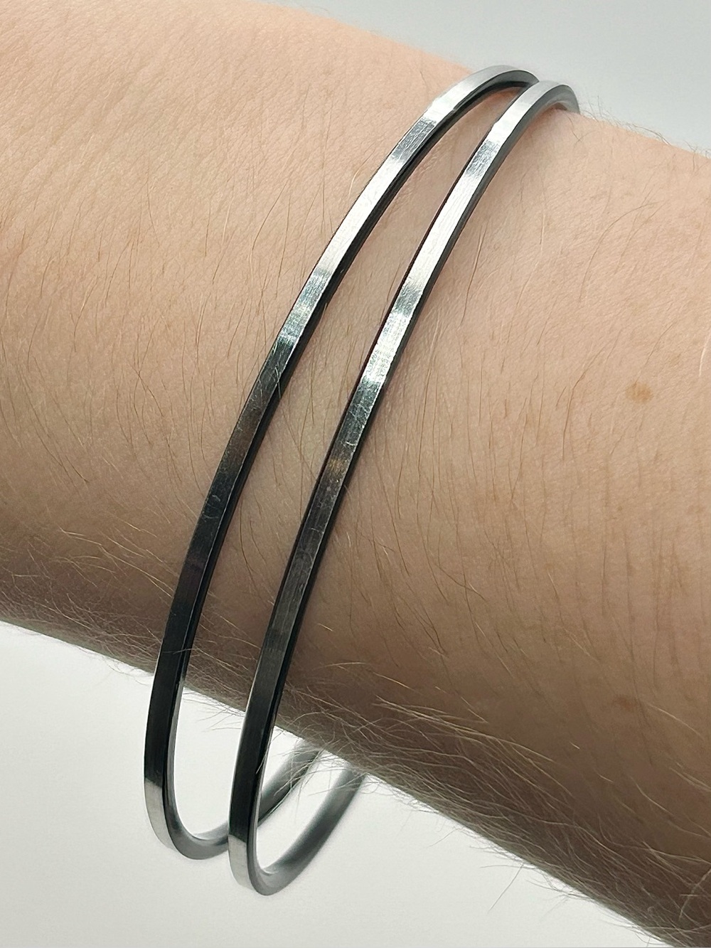 Silver Tone Bangle Bracelet Set of 2 - Metallic Band with Sleek Black Finish